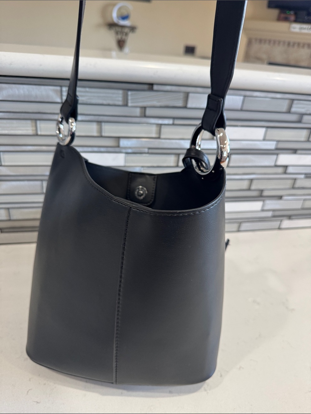 Madison West Black Bucket Shoulder Bag with Silver Rings Accent